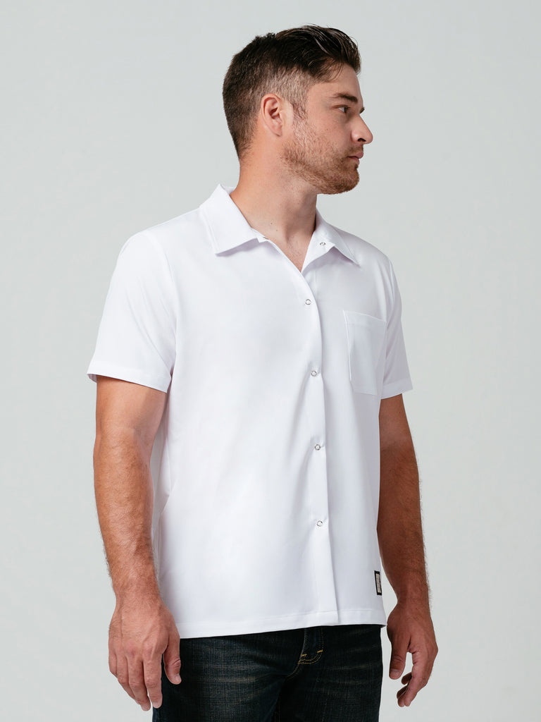 Man looking away from the camera modeling Helt's Utility Work Shirt in white.