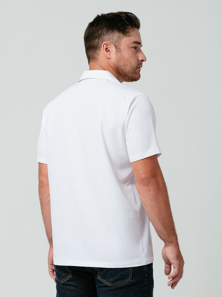 Man modeling the back of Helt Studio's Utility Work Shirt in white.