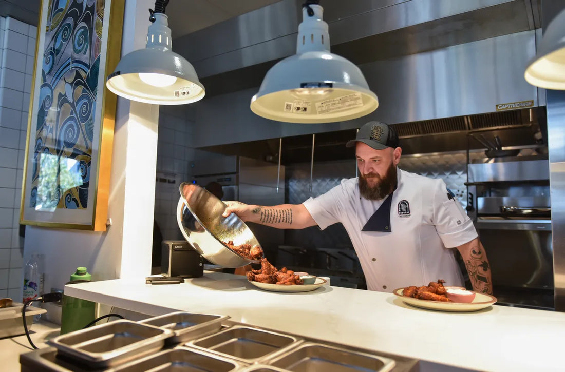 Man wearing a home apron while cooking in the kitchen.