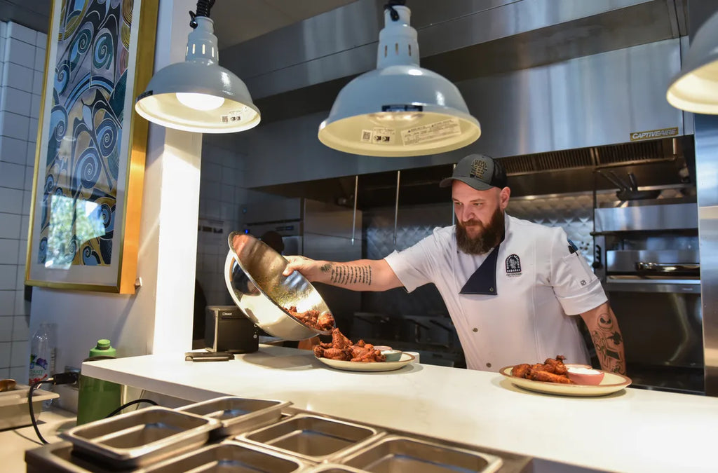 Man wearing a home apron while cooking in the kitchen.