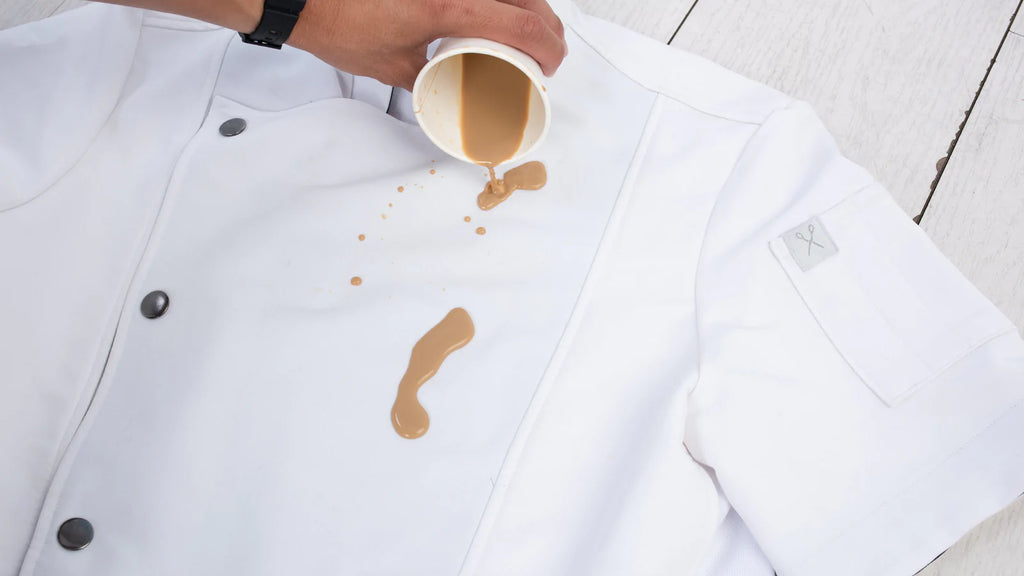Coffee being spilled on chef’s jacket made from water repellent fabric