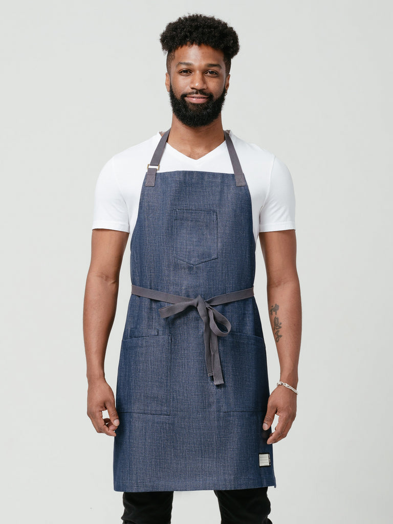 Man modeling Helt Studio's Raw Bar Denim Chef Apron with Pockets.
