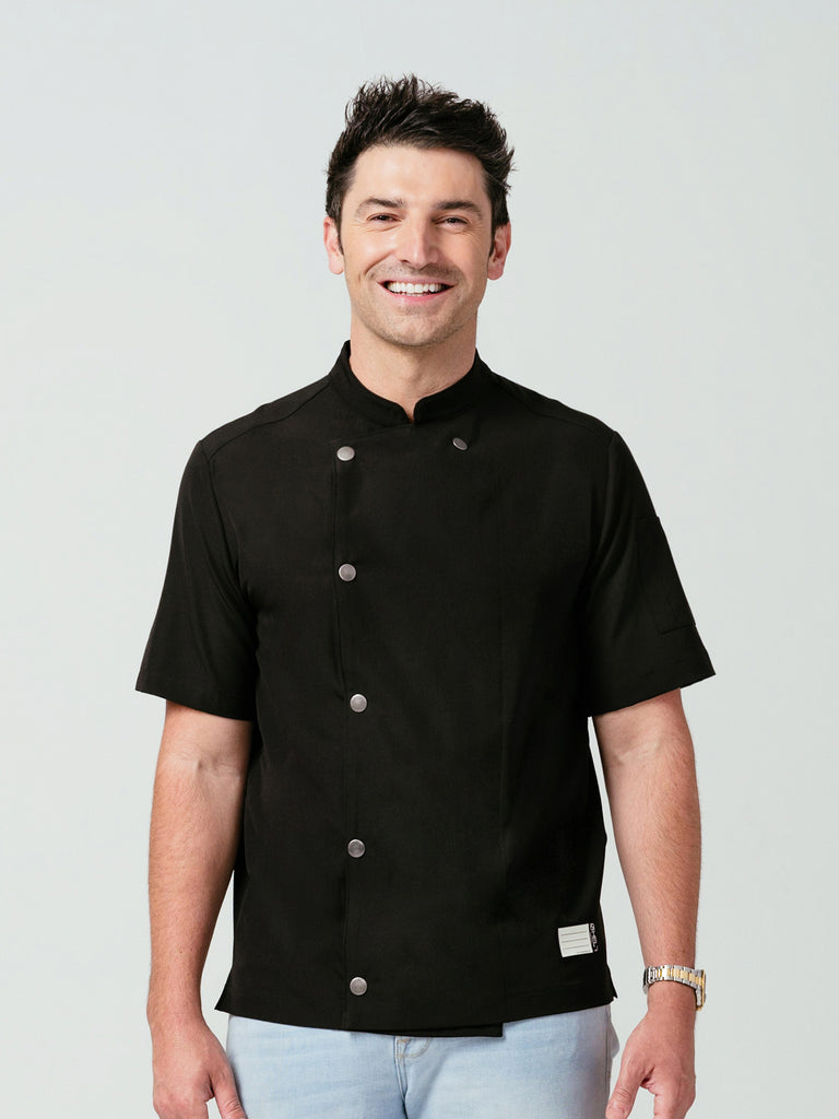 Man modeling Helt Studio's Midtown Chef Coat in black.