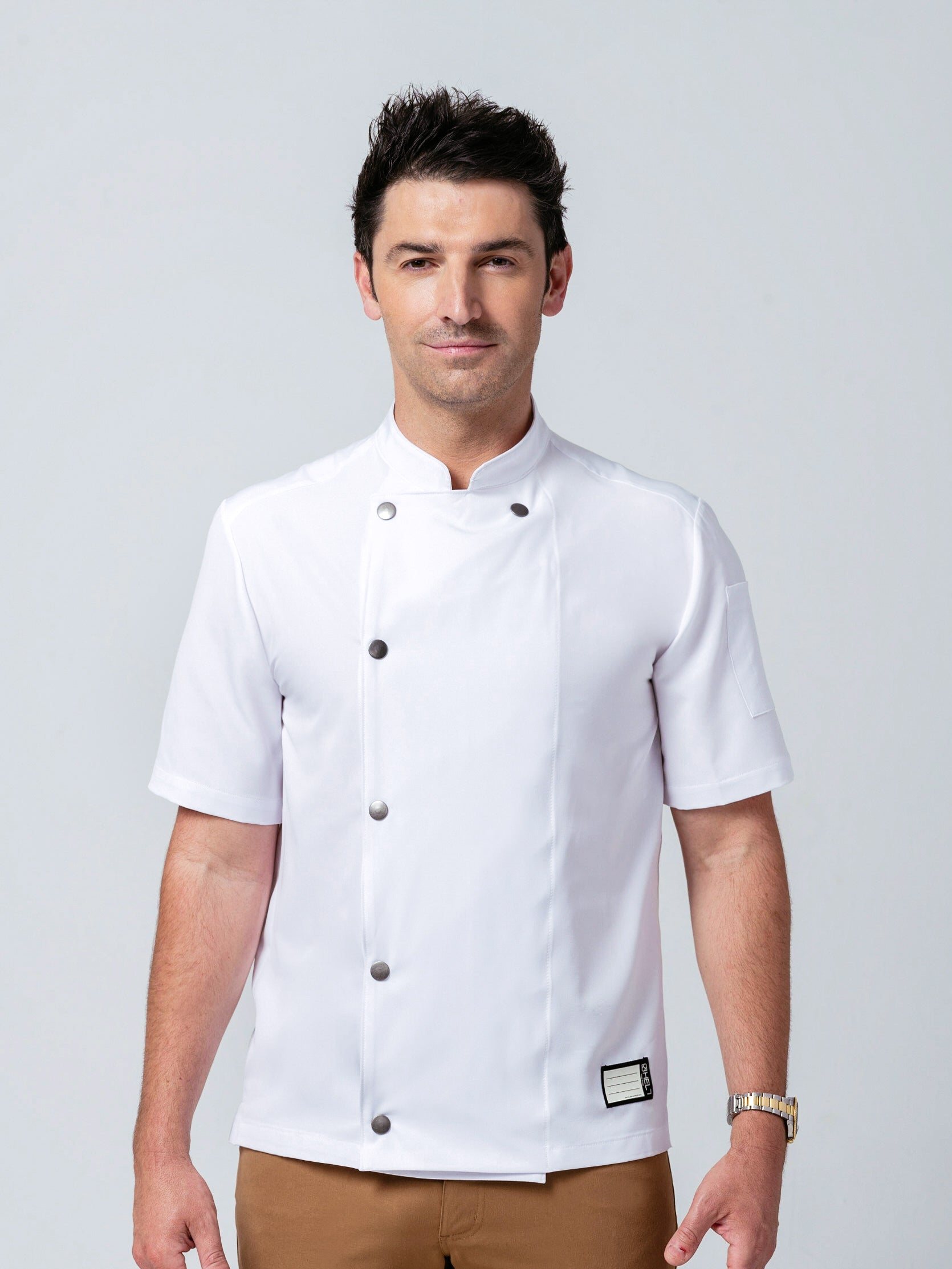Man wearing Helt Studio's Midtown Chef Coat in white.