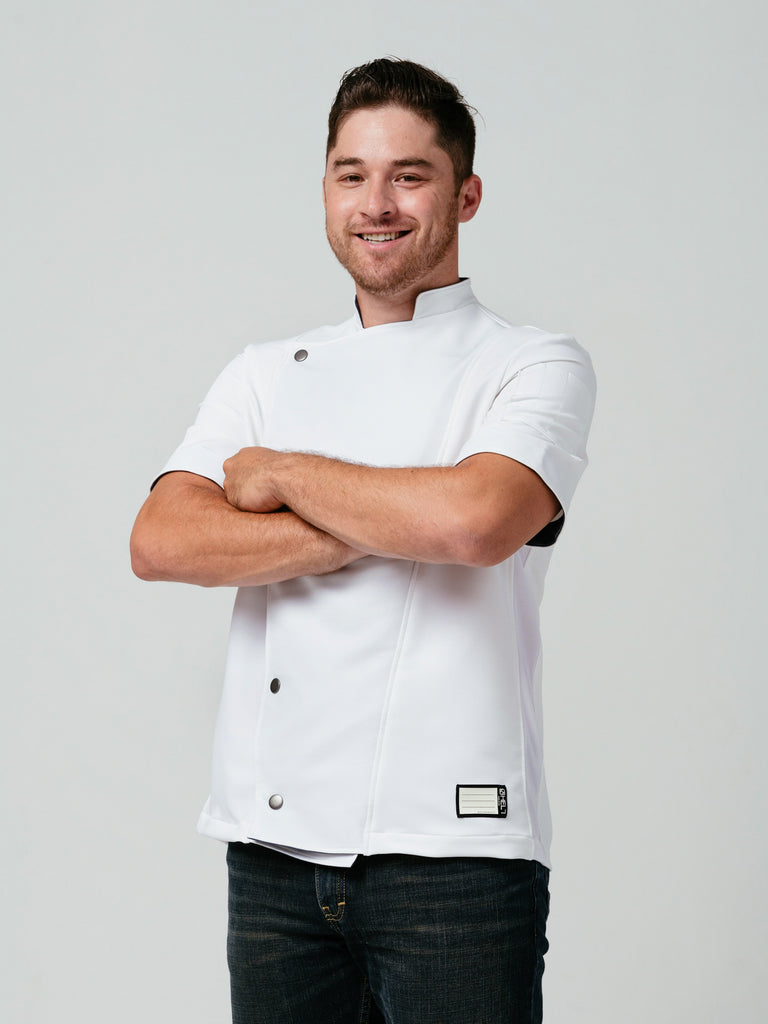 Man posing with his arms crossed modeling Helt Studio's Hipster Chef Coat in white.