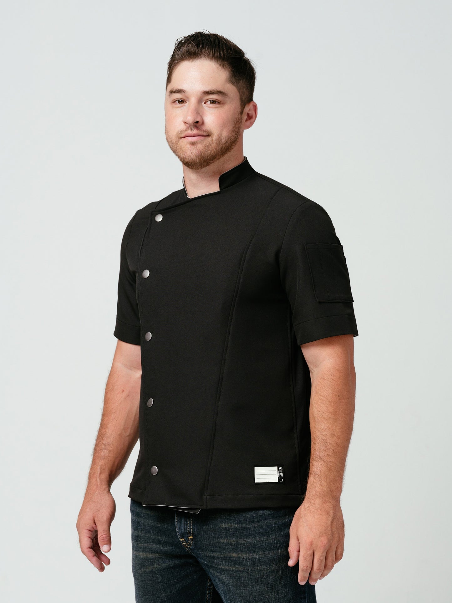 Man modeling Helt Studio's Hipster Chef Coat Noir.