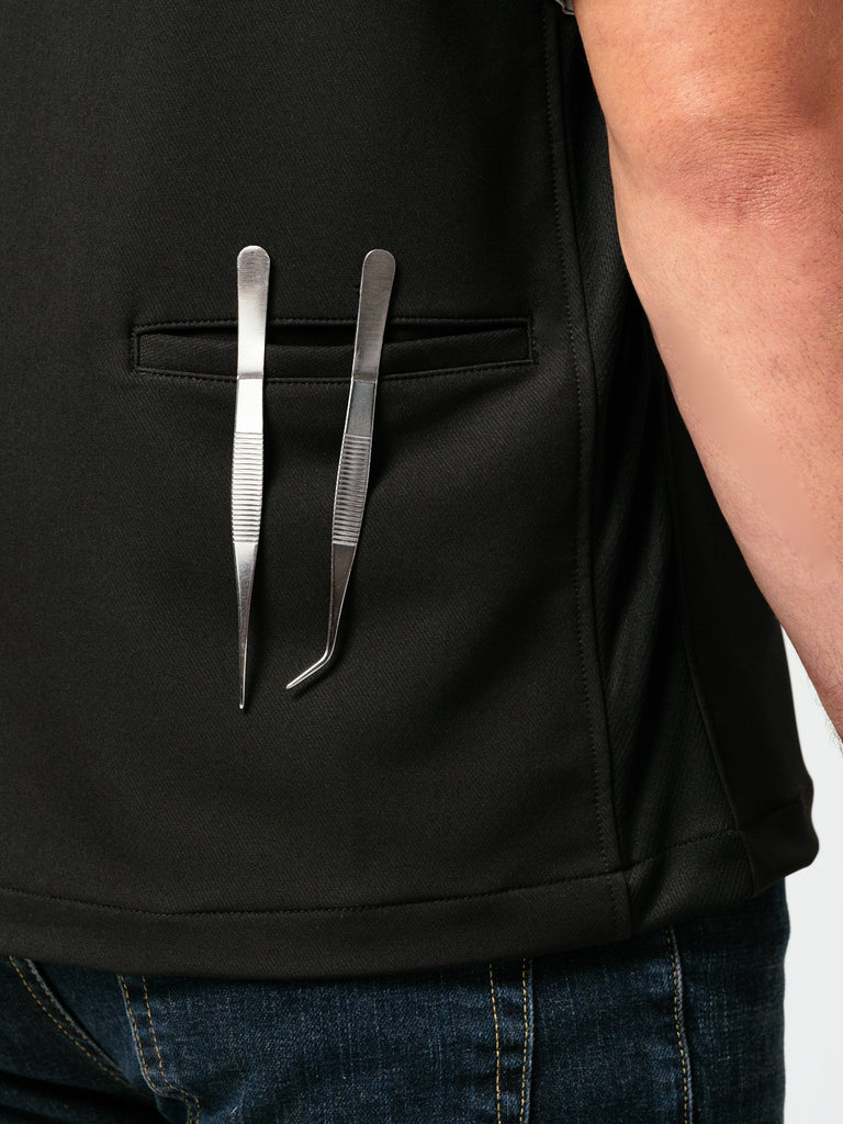 Close up Helt's Hipster Chef Coat Noir rear pocket holding metal plating utensils.