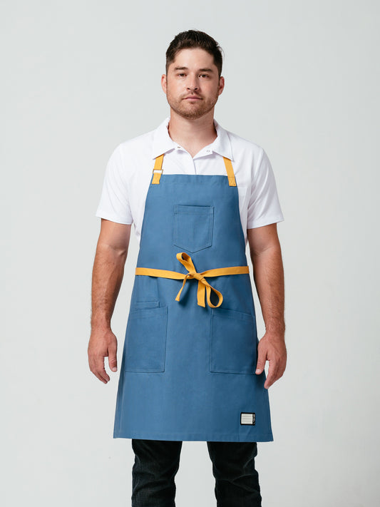 Man modeling Helt Studio's Pot of Gold Bib Apron.