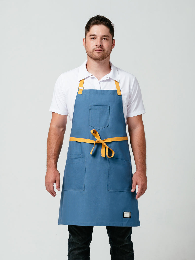 Man modeling Helt Studio's Pot of Gold Bib Apron.