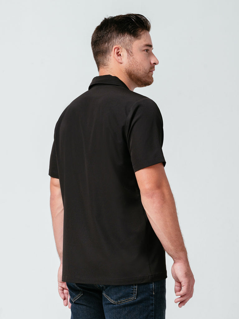Man modeling the back of Helt Studio's Utility Work Shirt in black.