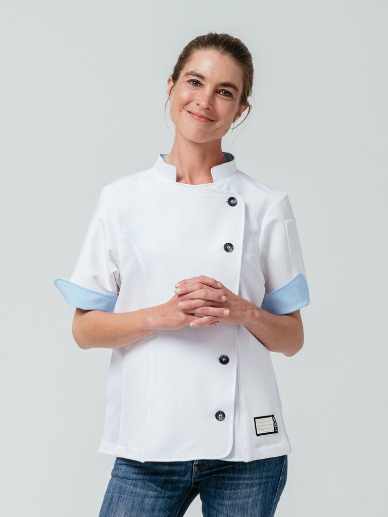 Woman modeling Helt Studio's Stephany Chef Coat in white.