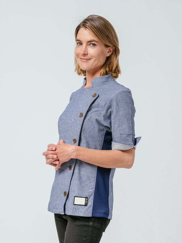 Woman modeling Helt Studio's Stephany Chambray Chef Coat.